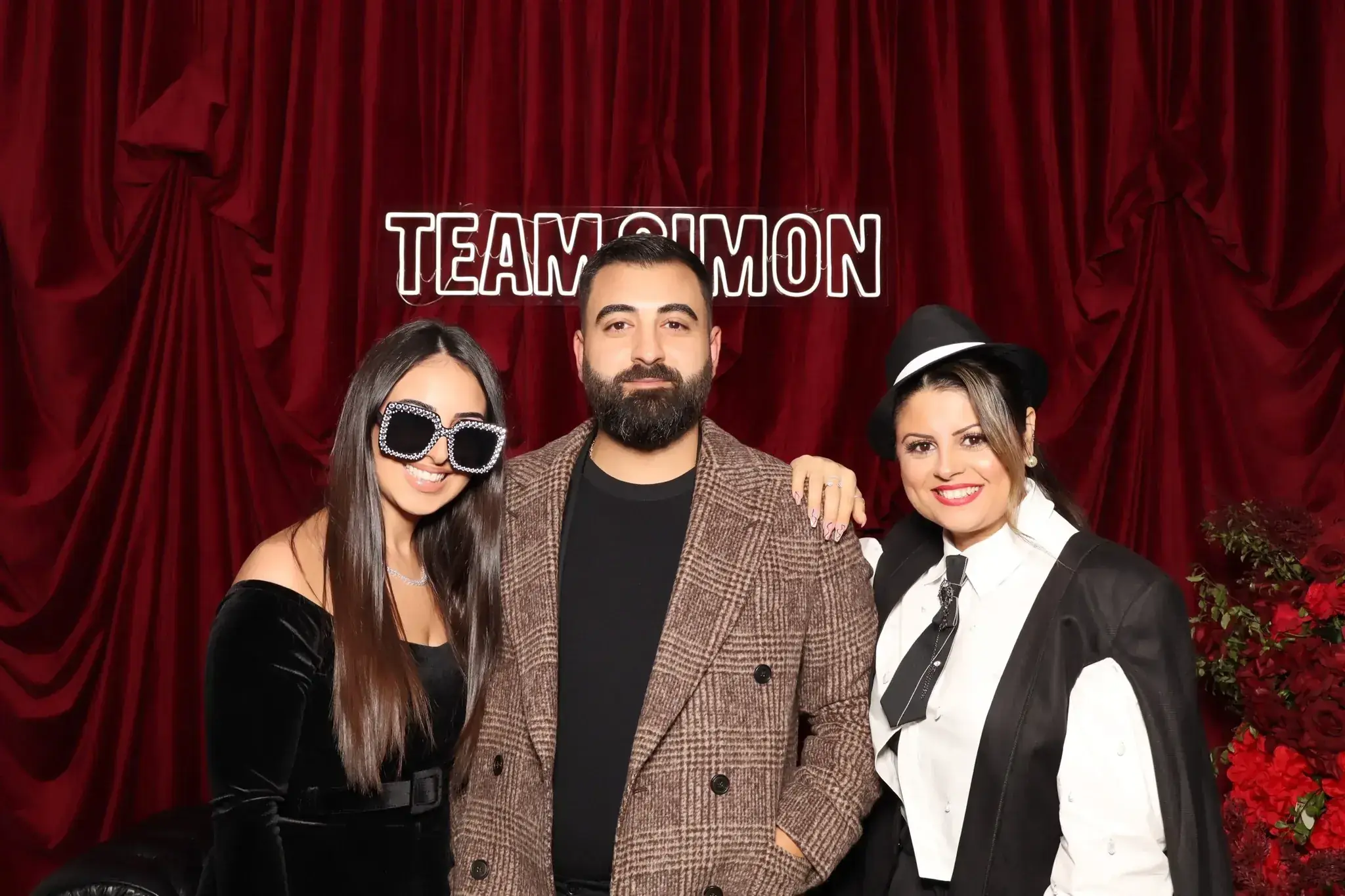 Guests using the Milas Events photo booth at a gala dinner fundraiser at Le Montage